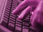 Fingers typing on keyboard